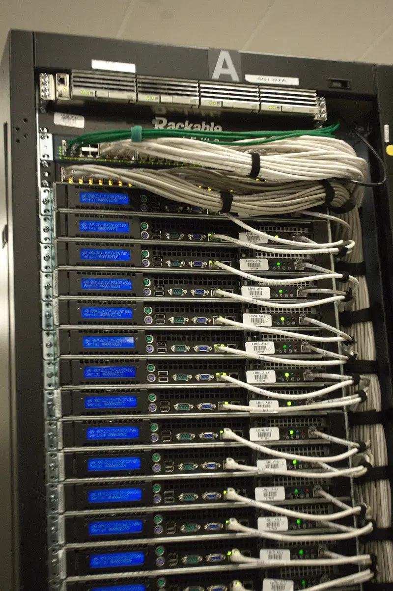 Close-up of a server rack labelled A, with a column of 1U servers and neatly bundled white network cables